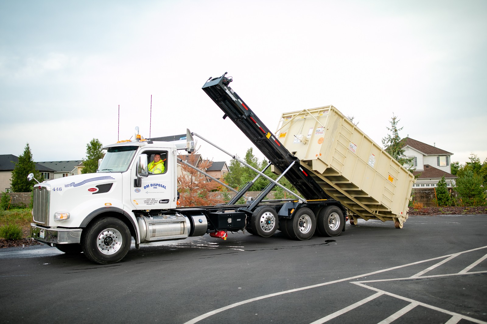 Photo of a DM Recycling driver dropping of a large drop box.