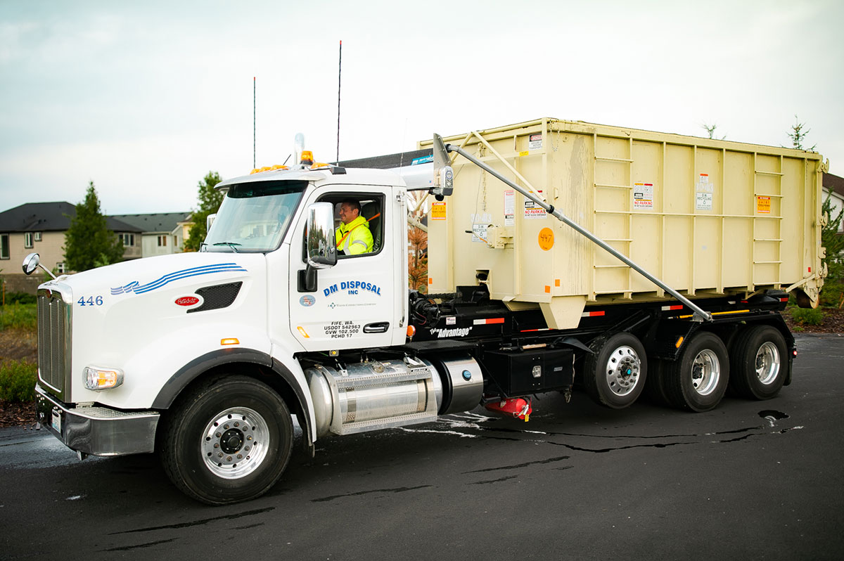 Photo of DM Recycling truck unloading a secure storage unit.