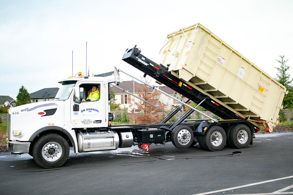 Photo of truck hailing a storage container.